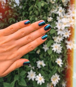 Beautiful nails on flowers background